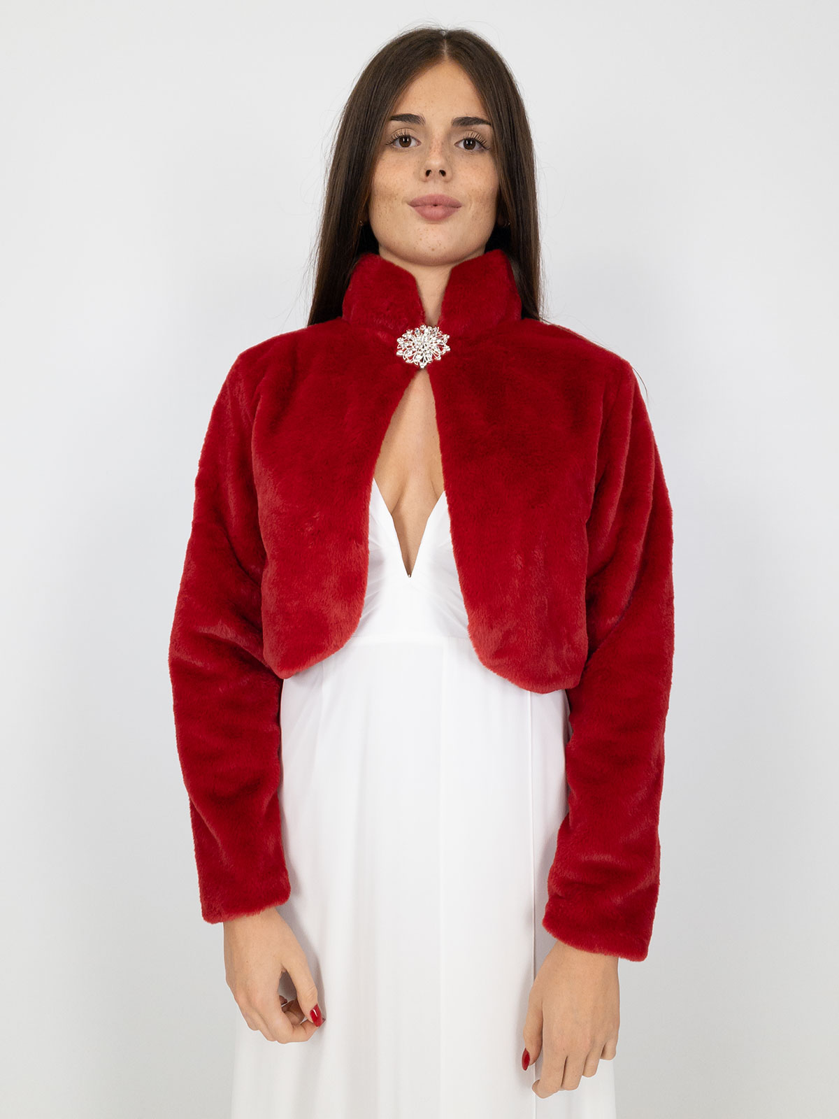Elegant short faux fur jacket with decorative brooch