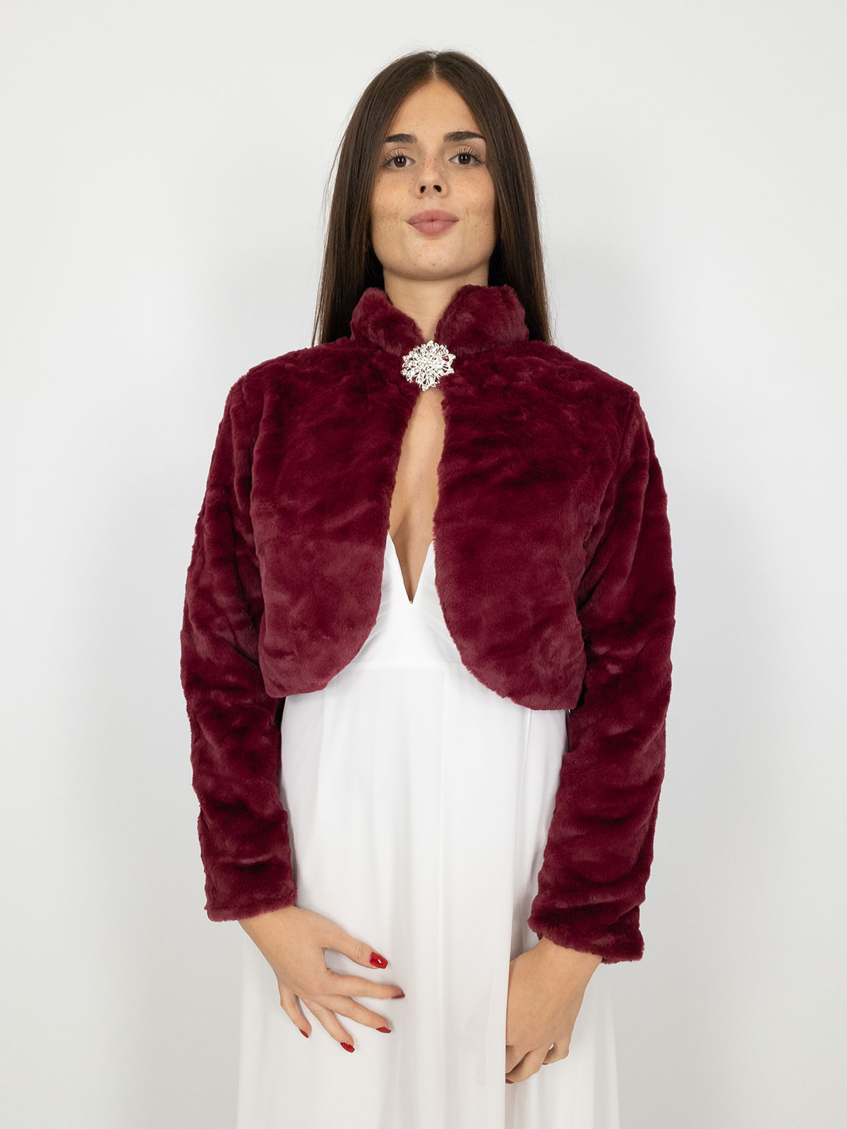 Elegant short faux fur jacket with decorative brooch