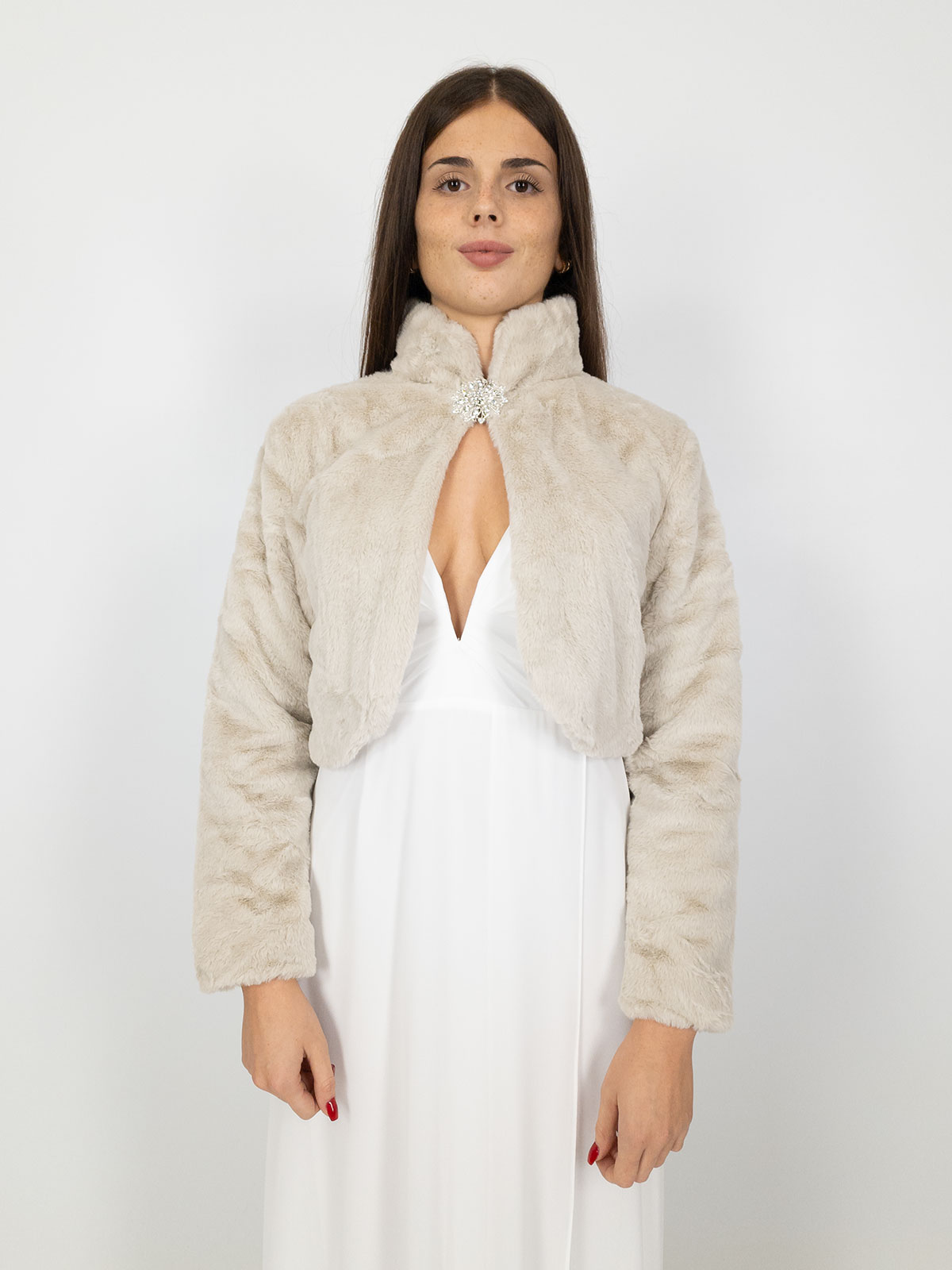 Elegant short faux fur jacket with decorative brooch