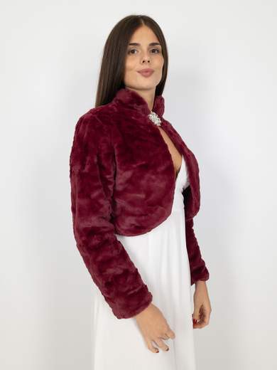 Elegant short faux fur jacket with decorative brooch