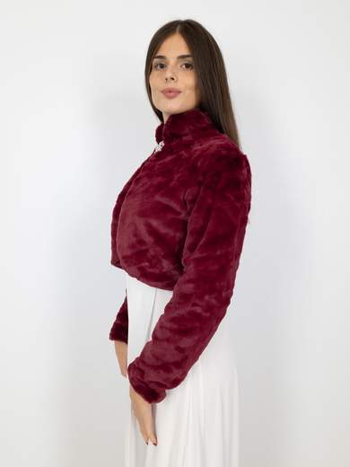 Elegant short faux fur jacket with decorative brooch