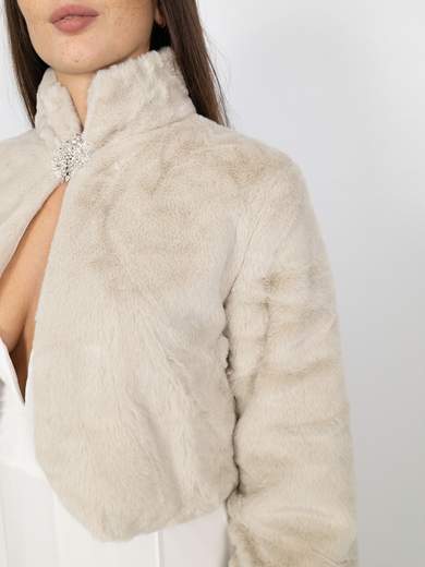 Elegant short faux fur jacket with decorative brooch