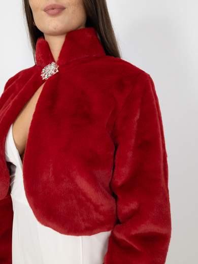 Elegant short faux fur jacket with decorative brooch