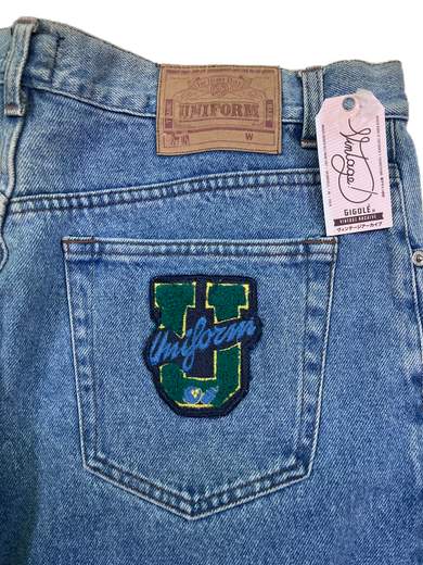 UNIFORM 311 U Jeans con toppa verde in spugna