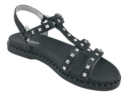 Sandalo basso donna NeroGiardini in pelle con borchie in acciaio, cinturino regolabile alla caviglia e sottopiede imbottito fussbett per un comfort urbano superiore.
