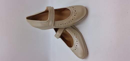 ANASTASIO DECOLLETE IN PELLE LAMINATA